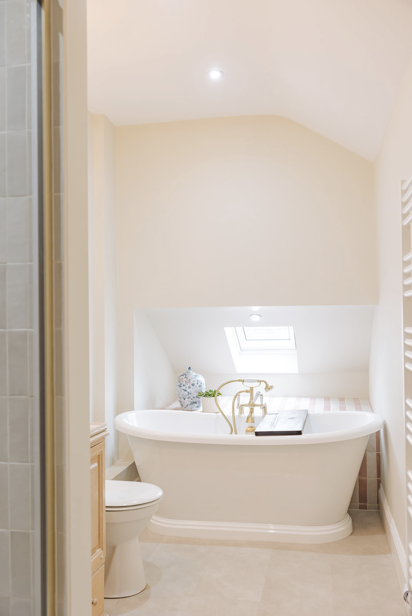Bathroom with freestanding bath and skylight