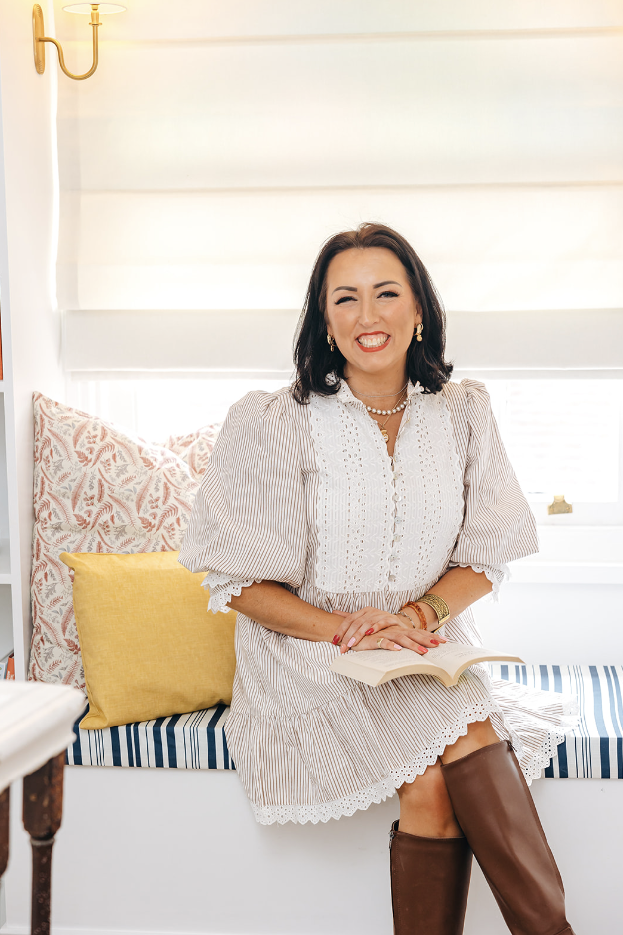 Camilla seated at the window seat