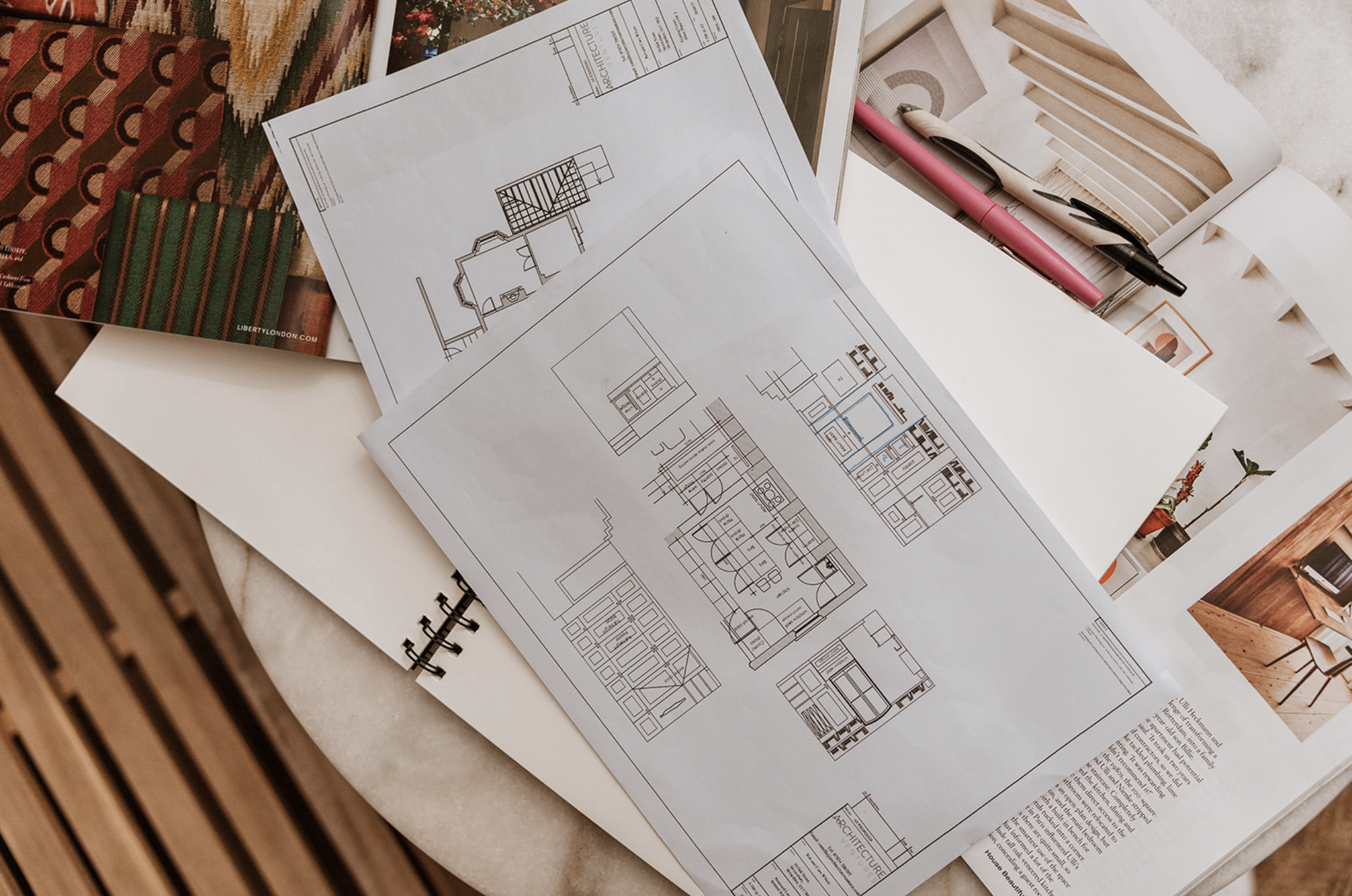 Architecture Ventures floor plans and elevations laid out with fabric and material samples
