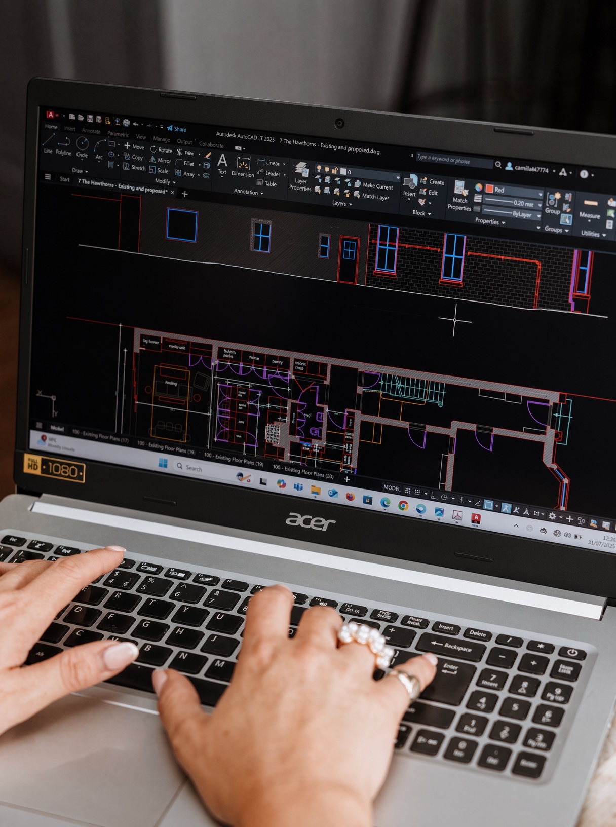 Existing and proposed floor plans and elevations open side by side in AutoCAD