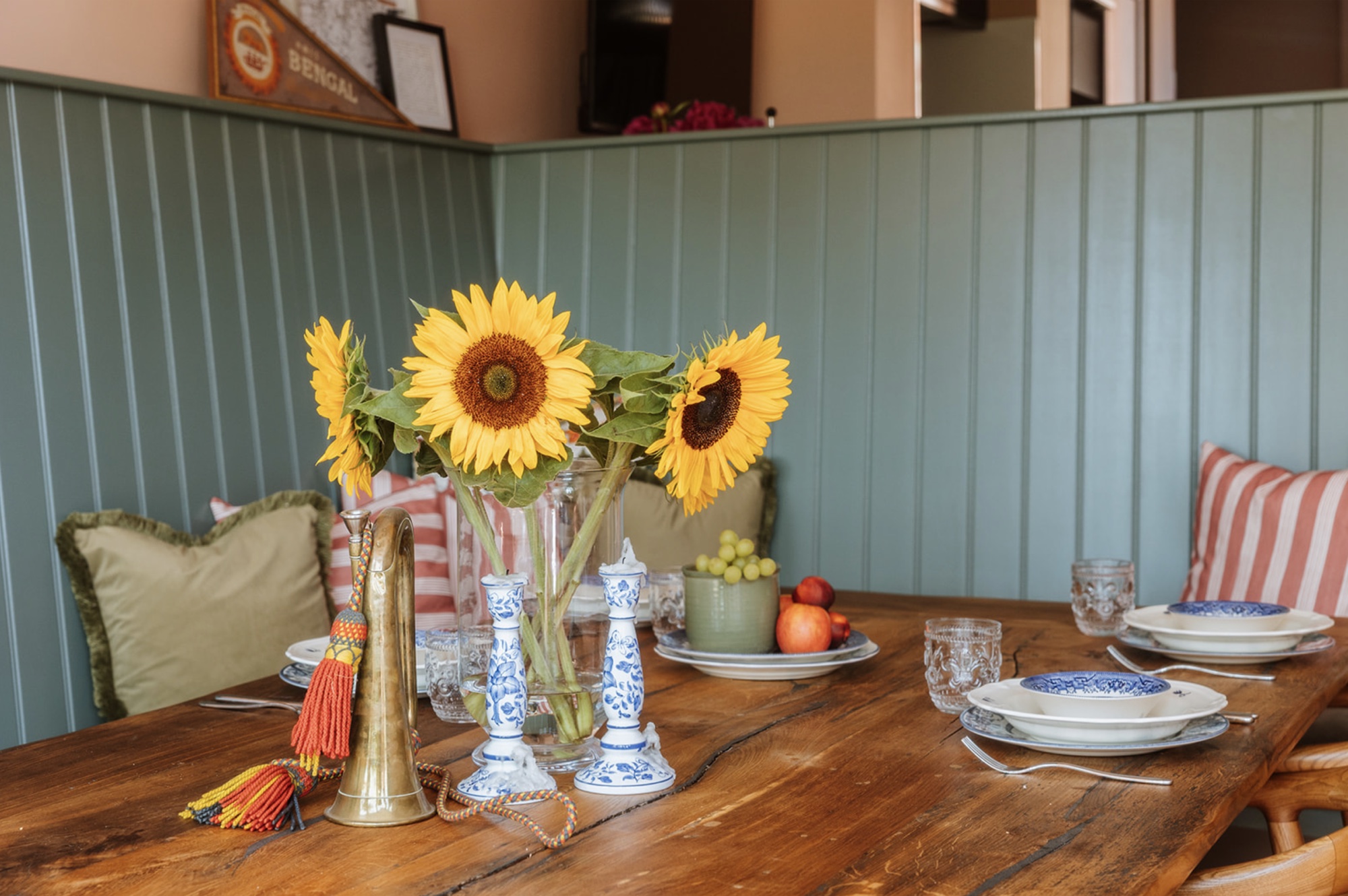 Oak Street dining table styled with sunflowers and blue-and-white china