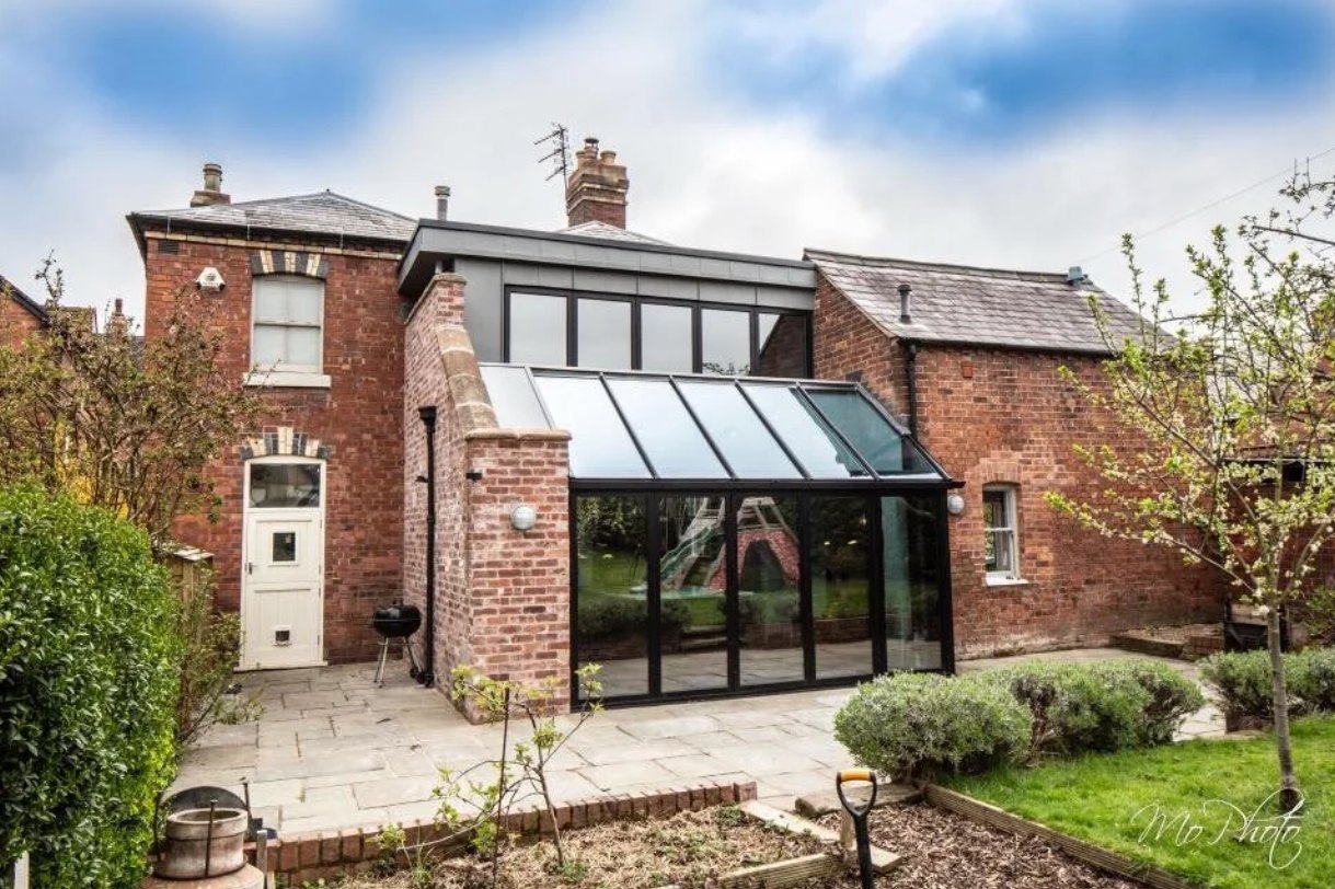 Oakleigh House rear elevation with the glazed lean-to extension between the main house and the coach house